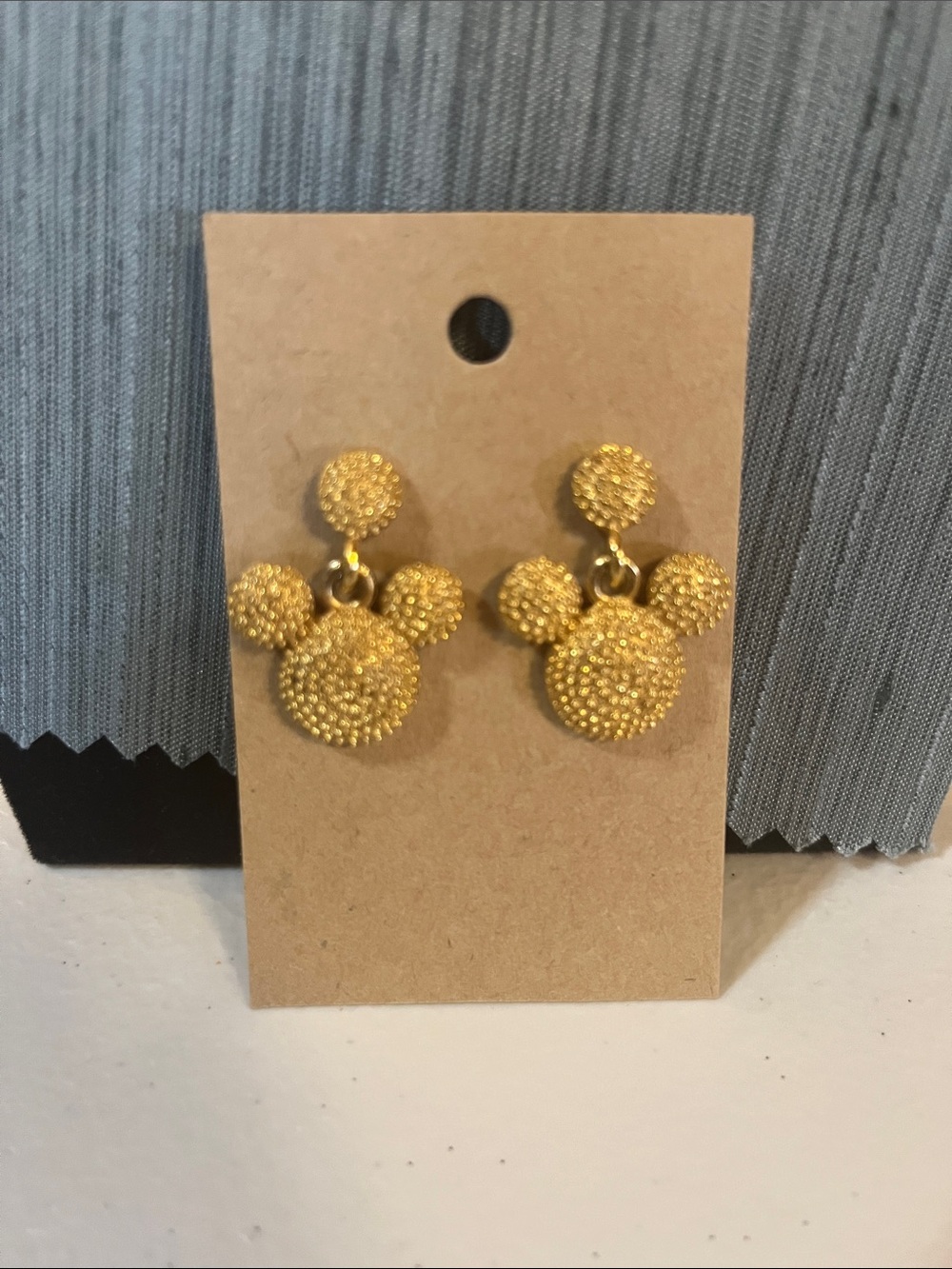 Gold tone what looks like Mickey Mouse earrings, post